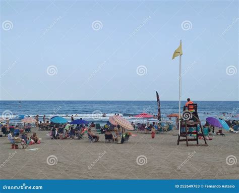 Yellow Flag. Beach. Yellow Flag To Be Careful on the Shore of the Beach ...