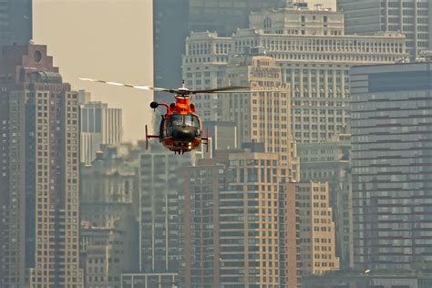 A private helicopter landing with the New York City skyline in the ...