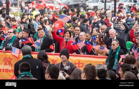 DC Mayor Muriel Bowser, center in red coat, leads the Chinese New Year Parade, January 26, 2020 ...