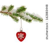 Photo of Single red bauble hanging on a Christmas tree | Free christmas images