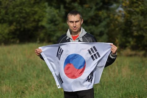 Premium Photo | South korea flag in hands