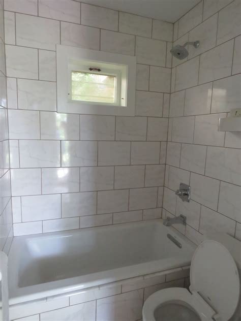 NEW AND FULLY TILED BATH -SMALL & EFFICIENT | Stone cabin, Small spaces, Bathtub