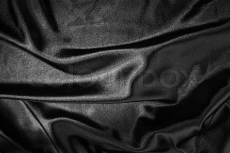 Shiny black satin pleated fabric ... | Stock image | Colourbox