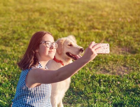 Premium Photo | Happy dog retriever and owner enjoying nature in the park