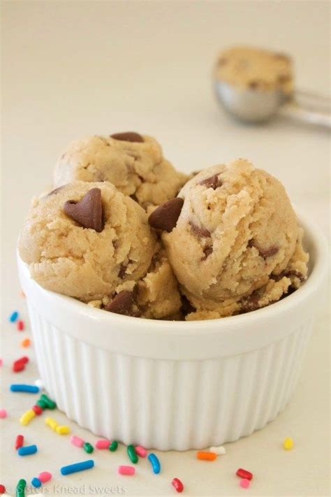 chocolate chip ice cream in a white bowl with sprinkles on the side
