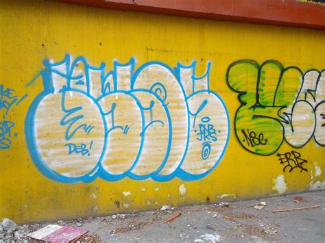 graffiti on a yellow wall, Metro Manila, Philippines – Gem's Photos and Videos