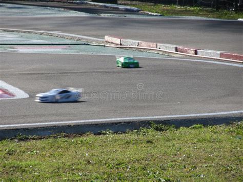 Small Radio Controlled Model Cars on the Track . Miniature Remote ...