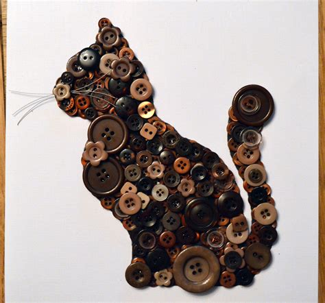 Stunning and unique cat artwork made out of different shades of brown buttons on a linen effect ...