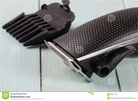 Hair Trimmer with Attachment on a Light Wooden Background Closeup Stock ...