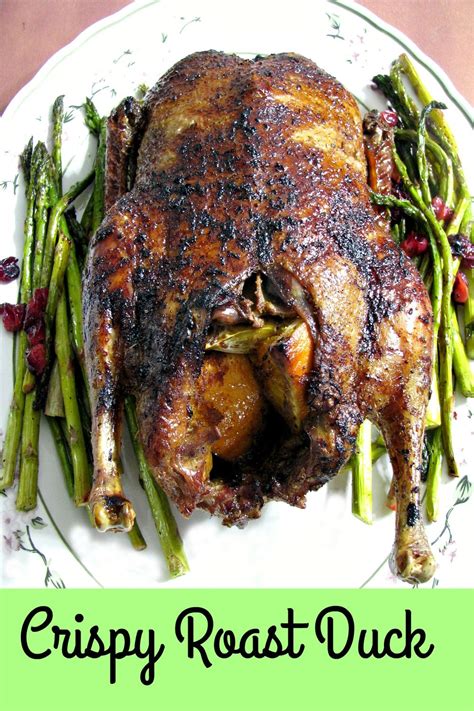 This flavorful Crispy Roast Duck stuffed with orange slices and garlic, then slow roasted and ...