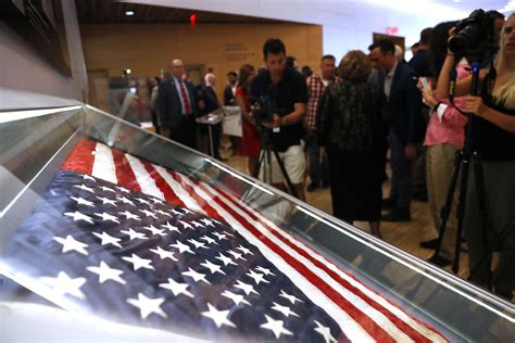 Iconic 9/11 flag raised at ground zero returns to site - CBS News