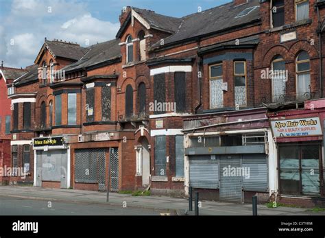 Row of terraced shops Princess Road,Moss Side,Manchester Stock Photo ...