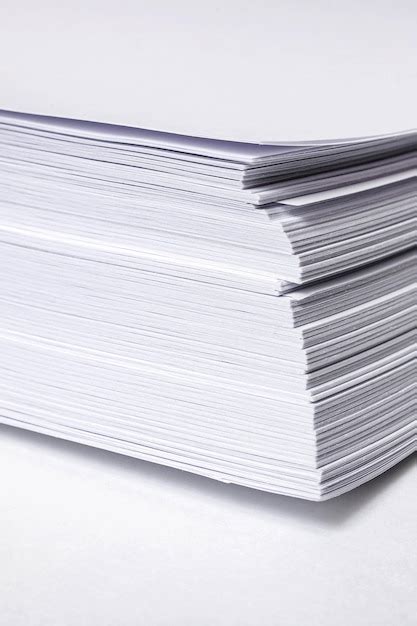 Premium Photo | Stack of white paper for printer on gray background