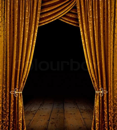 Golden curtains reveal open stage with ... | Stock image | Colourbox