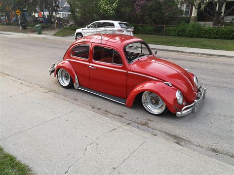 This Lowered 1960 VW Beetle W/ Custom wheels and Glitter red paint. : r/AwesomeCarMods