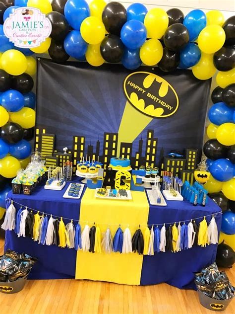 a batman themed birthday party with balloons and decorations