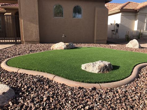 A patch of turf surrounded by gravel is a great way to create contrast ...