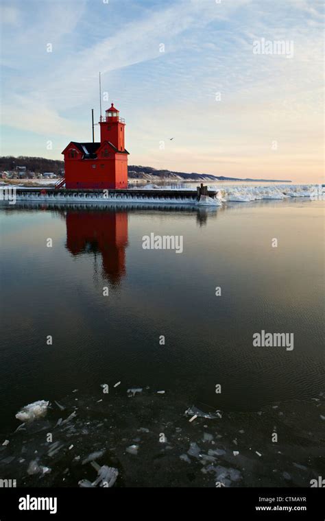 Big Red lighthouse at Holland State Park in the winter Stock Photo - Alamy