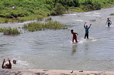 Stock Pictures: Children playing in the river water in rural India