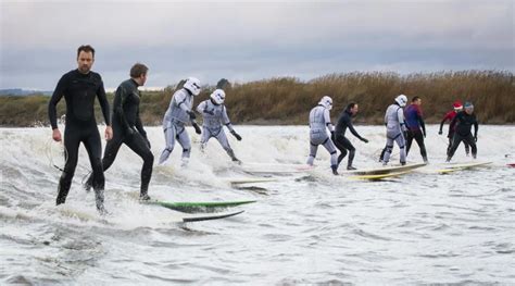 Surfers Conquer the Raging Severn Bore Tidal Surge - Mr Precious