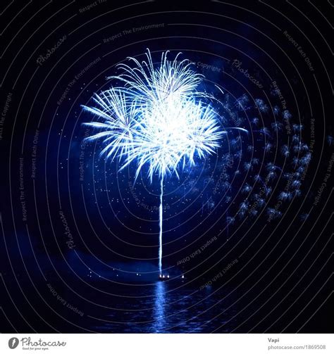 Blue fireworks with water reflection - a Royalty Free Stock Photo from Photocase