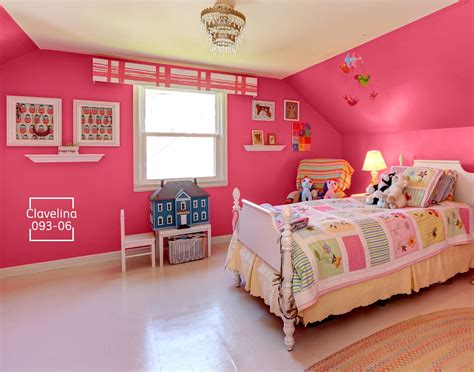 a bedroom with pink walls and white furniture