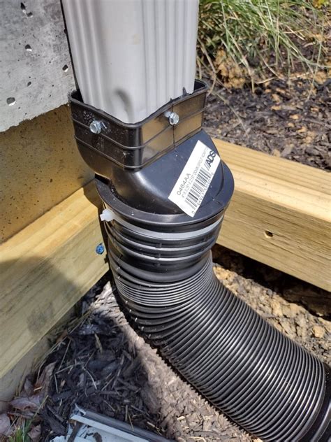 Easiest Way For Extending Gutter Downspouts - DIY Couple Blog