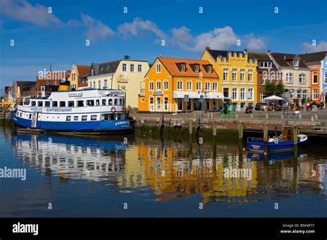 Husum Germany Schleswig - Holstein town city houses homes colored facades harbour port sea ships ...