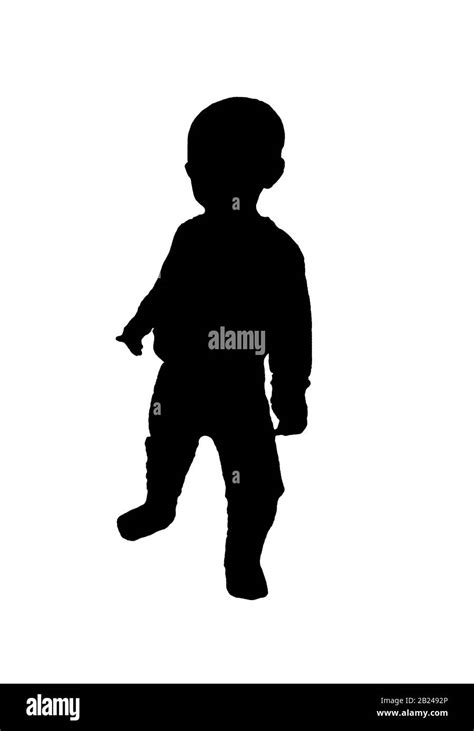 kid boy silhouette standing black empty background Stock Photo - Alamy