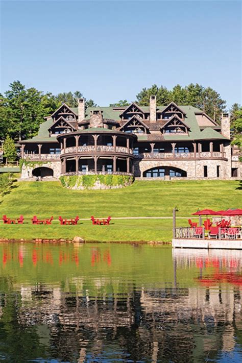 Rising on a gentle slope above the water, Lake Placid Lodge balances its rustic Adirondack ...