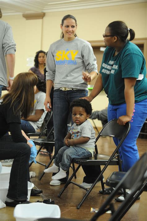 Ticha Penicheiro, number 21, talks to individuals at the Sky Cares Samaritan Feet Shoe ...