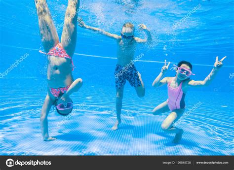 Little Kids Swimming Pool Underwater Stock Photo by ©yanlev 199545728