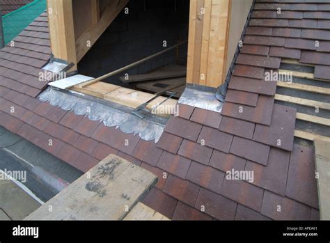 Close up of lead flashings dressed around dormer window and roof Stock ...