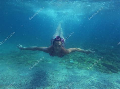 Woman diving underwater — Stock Photo © NewNow #78836136