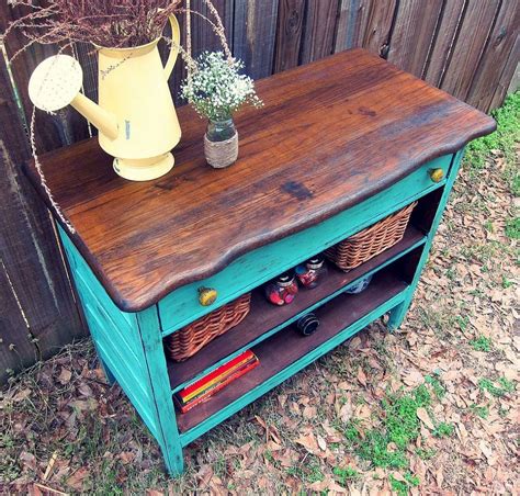 take an old dresser with broken drawers and turned it into a functional piece. love the colors ...