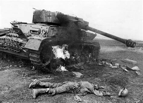 Destroyed German tank Pz.Kpfw. IV and killed soldier of the Wehrmacht ...
