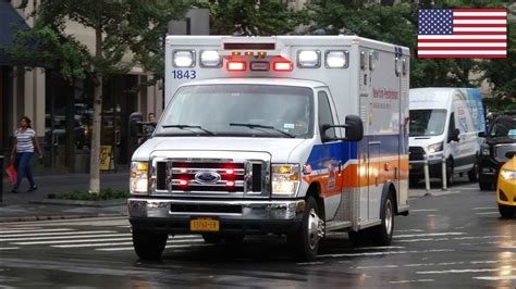 Ambulance responding on siren and lights in a rainy New York City - YouTube