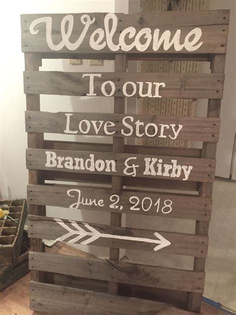 a wooden sign that says welcome to our love story