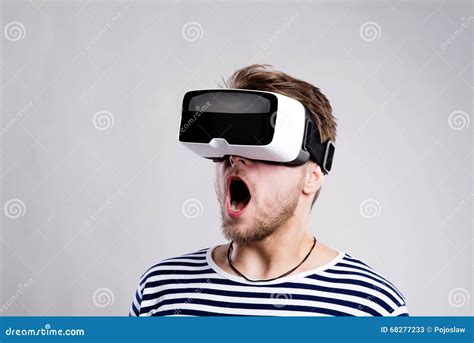 Man Wearing Virtual Reality Goggles. Studio Shot, Black Backgrou Stock Image - Image of device ...