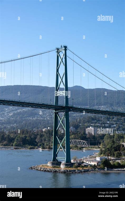 An aerial view of Lions Gate Bridge on blue sky background in Vancouver ...