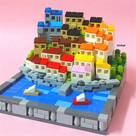 a lego model of a city with boats on the water
