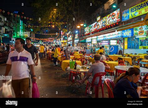 The street food night market on Jalan Alor in central Kuala Lumpur, where stalls offer ...