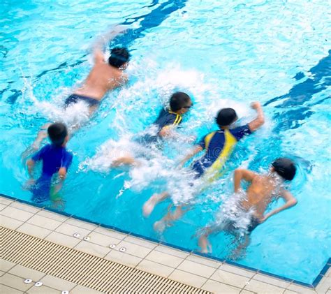 Boys in the Swimming Pool stock photo. Image of surface - 3443376