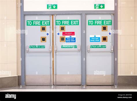 Fire exit glass door at indoor shopping mall for emergency use Stock ...