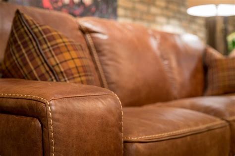 No detail is missed with this butter-soft leather sofa with contrast baseball stitching. | Brown ...