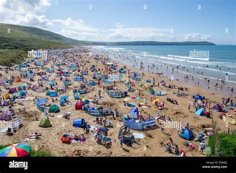 Busy Woolacombe beach in the summer season voted best UK beach for a ...