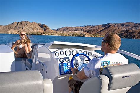 two people sitting on a boat in the water