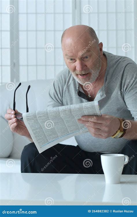 Senior Old Man Reading Newspaper at Home Stock Photo - Image of adult, knowledge: 264882382