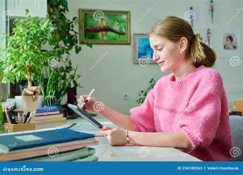 Teenage Girl Student Illustrator Drawing on Digital Tablet Sitting at Desk at Home Stock Image ...