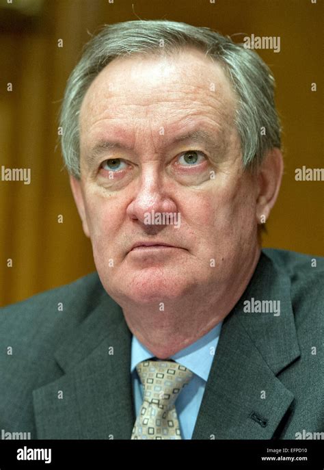 United States Senator Mike Crapo (Republican of Idaho) listens as Stock ...